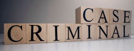 Criminal case word from wooden cubes. Crime and crime concept.