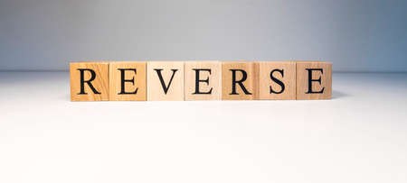 Reverse text from wooden cubes. Photo was taken in spot light on white background.の写真素材