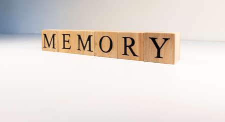 Memory text from wooden cubes. Photo was taken in spot light on white background. Close up.の写真素材