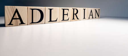 Adlerian psychology text from wooden cubes. The term psychology profession.の写真素材