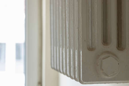 Cast iron radiator close-up. Part of the radiator was pulled.の写真素材