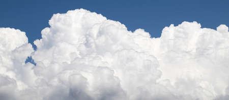 blue sky with clouds closeup. Cloudy sky close-up. A photo was taken on a sunny day in the summer.