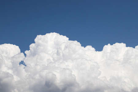 blue sky with clouds closeup. Cloudy sky close-up. A photo was taken on a sunny day in the summer.の写真素材