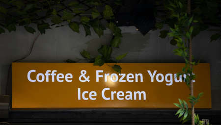 Advertising sign with coffee and frozen yogurt and ice cream
