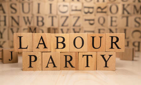 The word Labor Party is made of wooden cubes. Economy state government terms. Background made of wooden letters.の写真素材