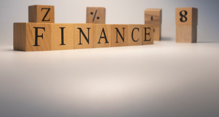 The word finance is from wooden cubes. Background from wooden letters.の写真素材