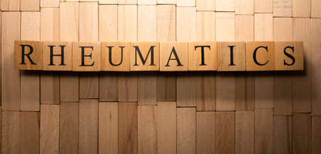 The word Rheumatism was created from wooden cubes. Health and life. Close up.の写真素材