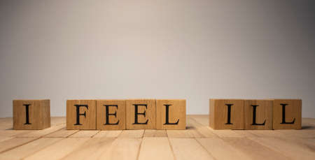 The word I fell ill was created from wooden cubes. health and lifeの写真素材