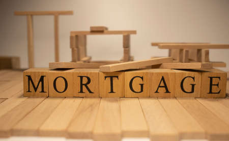 The word mortgage was created from wooden cubes. business and market. close up.の写真素材