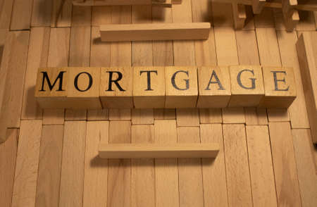 The word mortgage was created from wooden cubes. business and market. close up.の写真素材