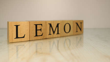 The word peel lemon was created from wooden letter cubes. Gastronomy and spices.