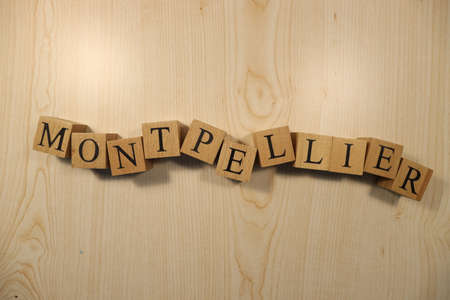 The word Montpellier was created from wooden letter cubes. Cities and words. close up.の写真素材
