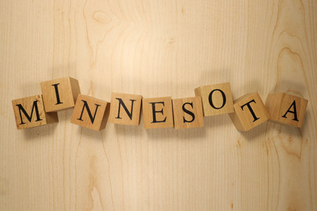 The word Minnesota was created from wooden letter cubes. Cities and words. close up.の写真素材