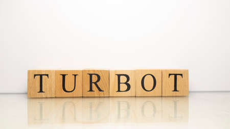 The name Turbot was created from wooden letter cubes. Seafood and food. close up.の写真素材