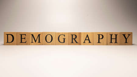 Demography name created from wooden letter cubes. Economics and finance.の写真素材