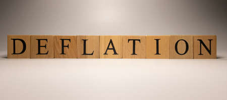 The name Deflation was created from wooden letter cubes. Economics and finance.の写真素材