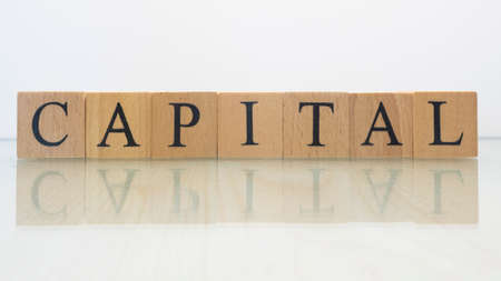 The name capital was created from wooden letter cubes. finance and economy. close up.の写真素材