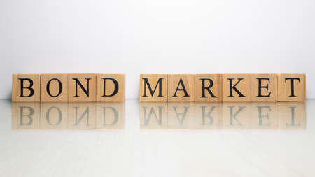 The name Bond market was created from wooden letter cubes. finance and economy. close up.の写真素材