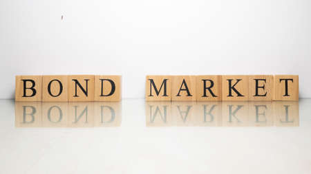 The name Bond market was created from wooden letter cubes. finance and economy. close up.の写真素材