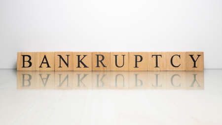 The name Bankruptcy was created from wooden letter cubes. finance and illegal. close up.の写真素材