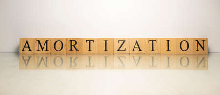 The name Amortization was created from wooden letter cubes. finance and economy. close up.の写真素材