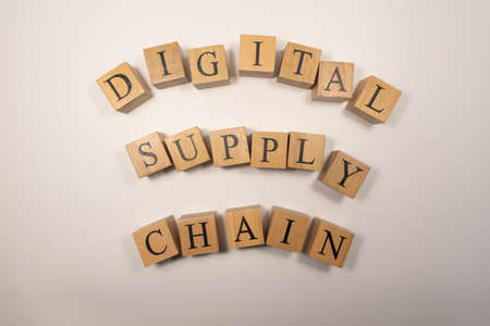 The digital supply chain was created from wooden cubes. Industry and technology. close up.