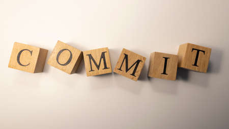 The word Commit was created from wooden cubes.の写真素材