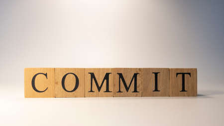 The word Commit was created from wooden cubes.の写真素材