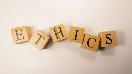 The word Ethics was created from wooden cubes. Rules and morals. close up.の写真素材