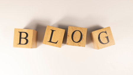 The word blog was created from wooden cubes. community and communication. close up.の写真素材