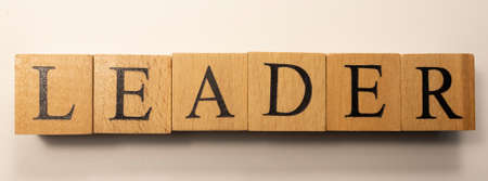 The word Leader was created from wooden cubes. Economy and education. close-up.の写真素材
