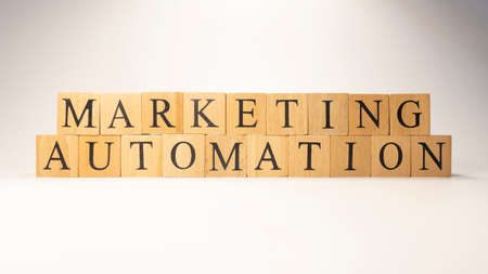 Marketing automation word created from wooden cubes. Consumption and shopping. close-up.の写真素材