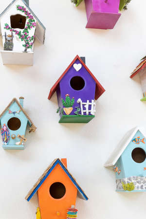 Close-up of colorful birdhouses. Hanging on the wall. muchの写真素材
