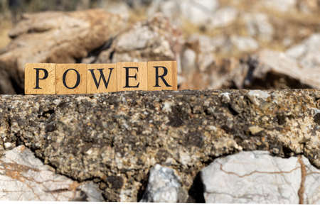 The Power Word was created from wooden cubes. Photographed on the wall. close-up.の写真素材
