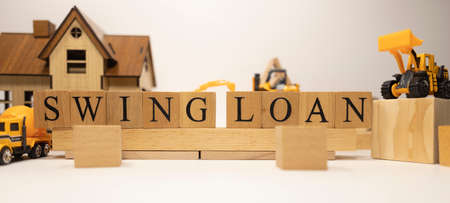 Swing loan was created from wooden cubes. Finance and Banking. close-up.の写真素材