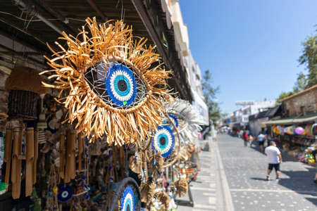 Decorative evil eye beads for sale. Hanging in front of the store. close-up.の写真素材