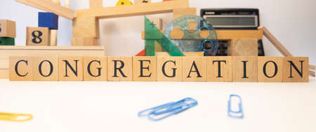 The word congregation was created from wooden cubes. close upの写真素材