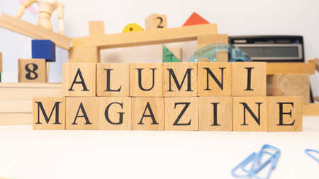 The word Alumnus magazine was created from wooden cubes.の写真素材
