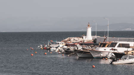 Lighthouse close-up. Harbor entrance. Outdoors on a sunny day.の写真素材