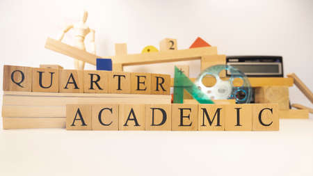 The word academic quarter was created from wooden cubes. Close-up.の写真素材