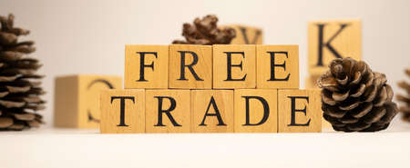 The word free trade was created from wooden cubes. close-up.