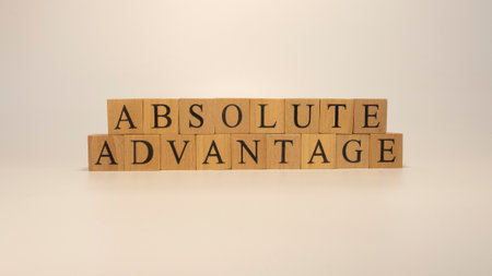 absolute advantage sentence written on wooden surface. economy and conceptの写真素材