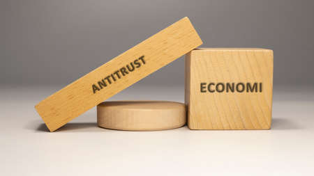 Antitrust written on wooden surface. economy and businessの写真素材