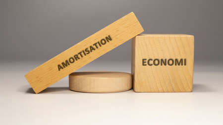 Amortization is written on the wooden surface. economy and businessの写真素材