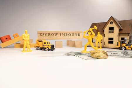Escrow impound was written on the wooden surface. economy and businessの写真素材