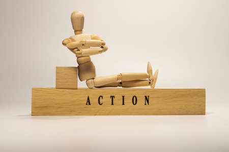 Action was written on a wooden surface. Personal development and education.の写真素材