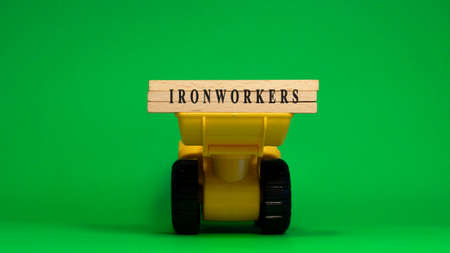 The word Ironworkers is written on wooden sticks. machine concept. job occupations.の写真素材