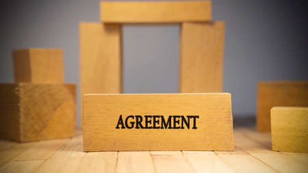 agreement was written on the wooden surface. Law and state system. Concept created from wooden sticks.の写真素材