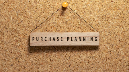 Purchase planning word written on wooden surface. Hanging on wooden board. work and educationの写真素材