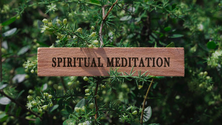 Spiritual meditation. Written on wooden surface. Background tree leaves. Mental health and lifestyle.の写真素材